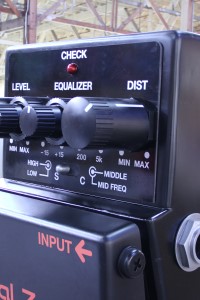 Large product replica of a BOSS guitar effects pedal - closeup view