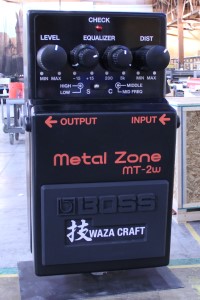 Large product replica of a BOSS guitar effects pedal - front view