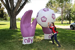 Foam prop of a giant soccer ball and soccer gloves