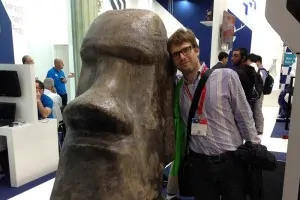 Man in a selfie with a large display statue