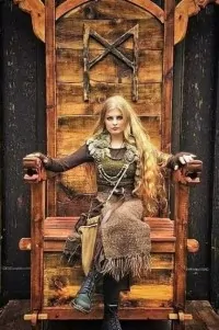 Woman sitting on Viking selfie throne