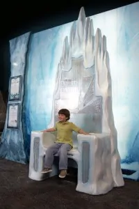 Boy sitting on Ice Queen's throne from Chronicles of Narnia