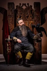 Man sitting on Viking throne